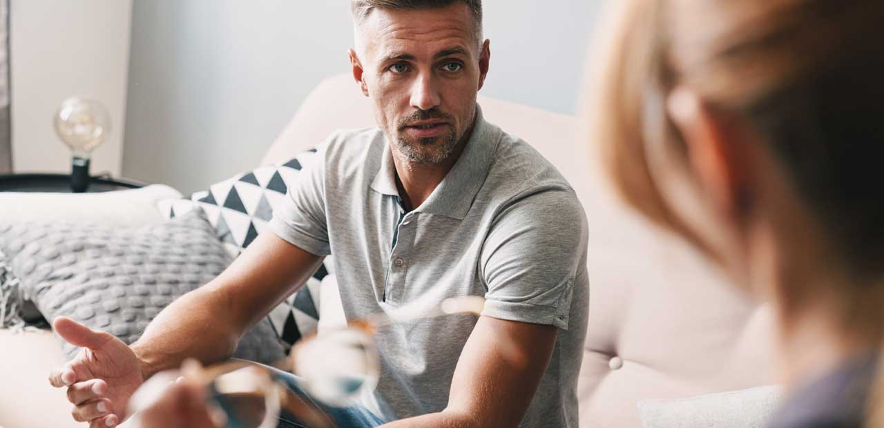 Man in therapy being counselled Man in counselling therapy receiving therapy advice
